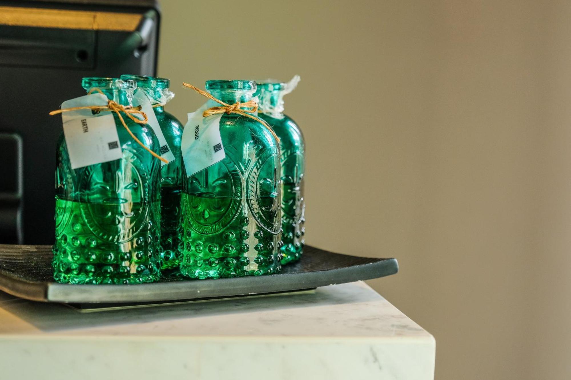 Fusion Suites Phuket Patong Buitenkant foto Bottles of absinthe